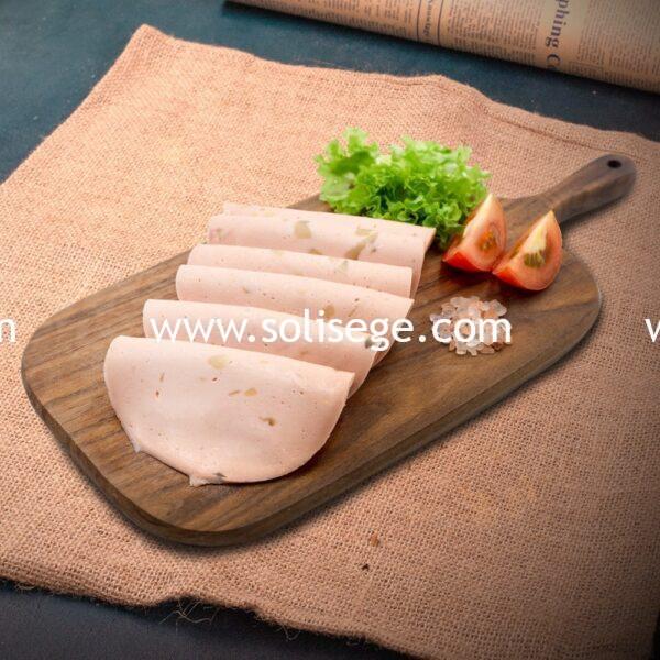 6 slices of Solisege chicken & mushroom meatloaf on a wooden board.